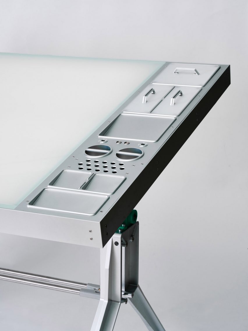 Close-up of compartments in aluminium desk
