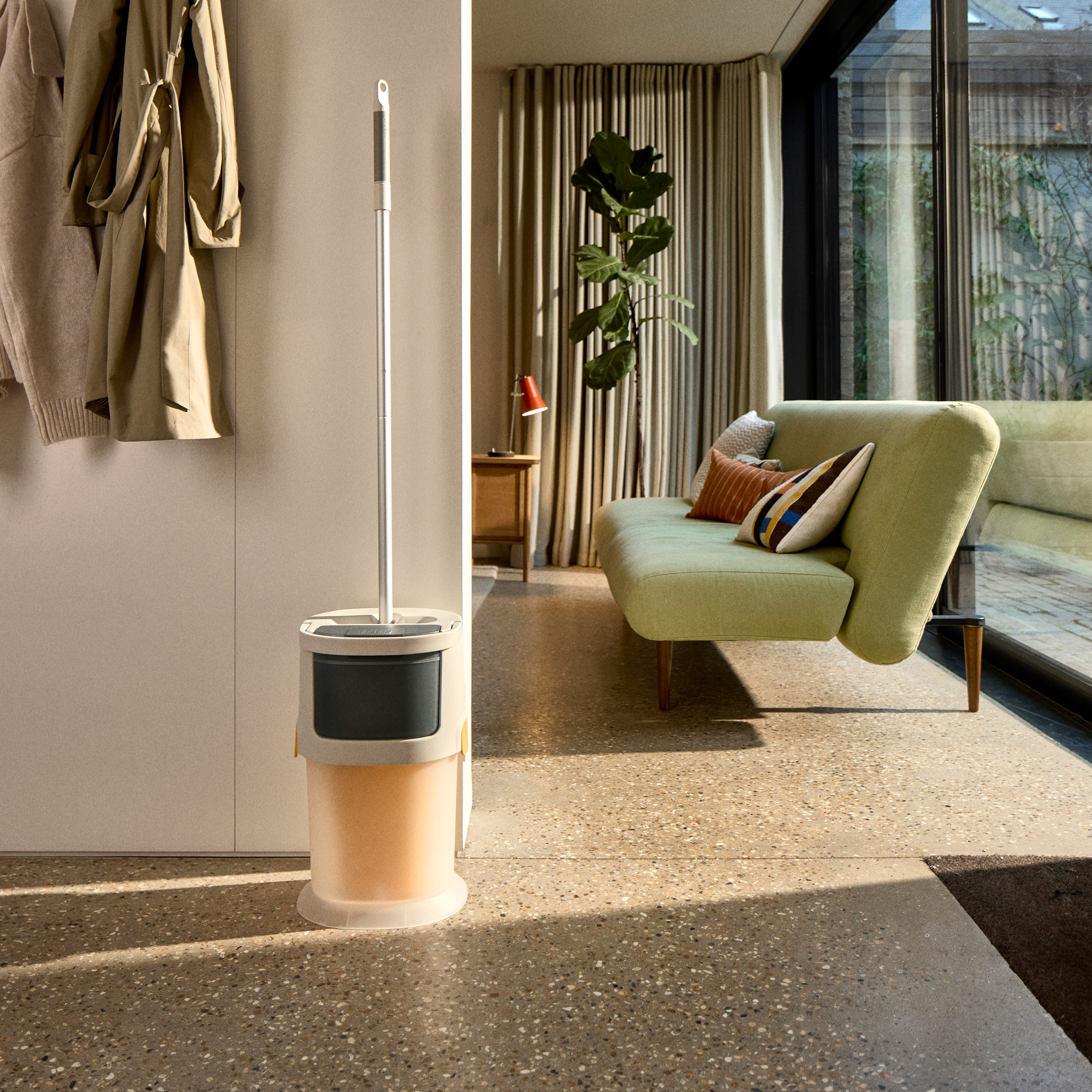 UltraClean mop and bucket stored in a compact corner of a living space