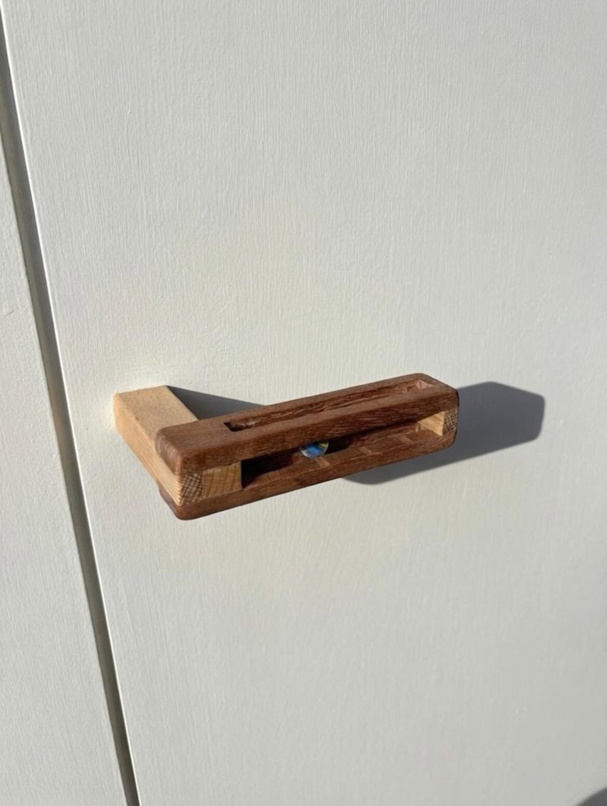 Wooden handle with marble
