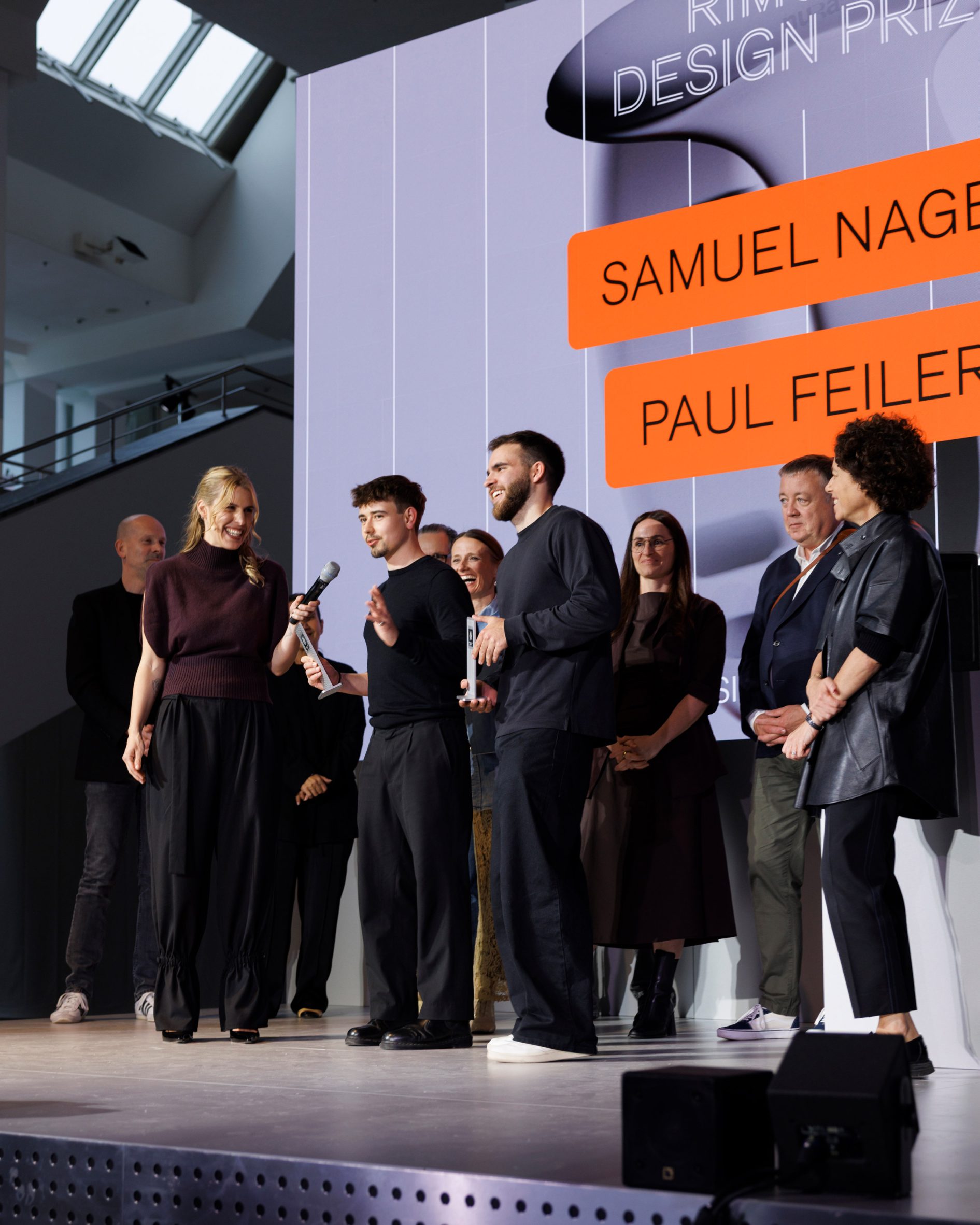 Samuel Nagel and Paul Feiler speaking on stage during the Rimowa Design Prize ceremony in Berlin