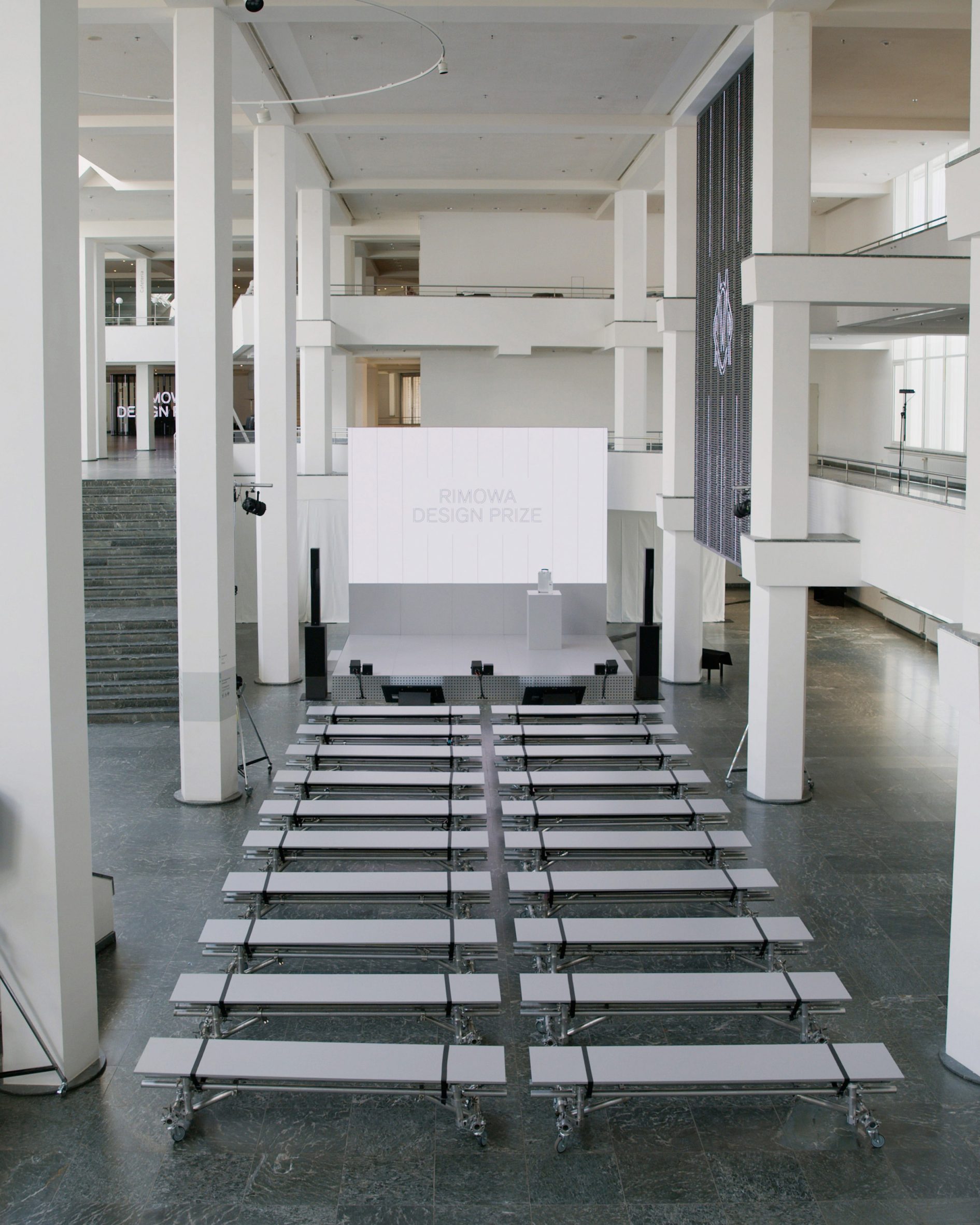 Wide view of the Rimowa Design Prize venue with rows of seating facing the stage