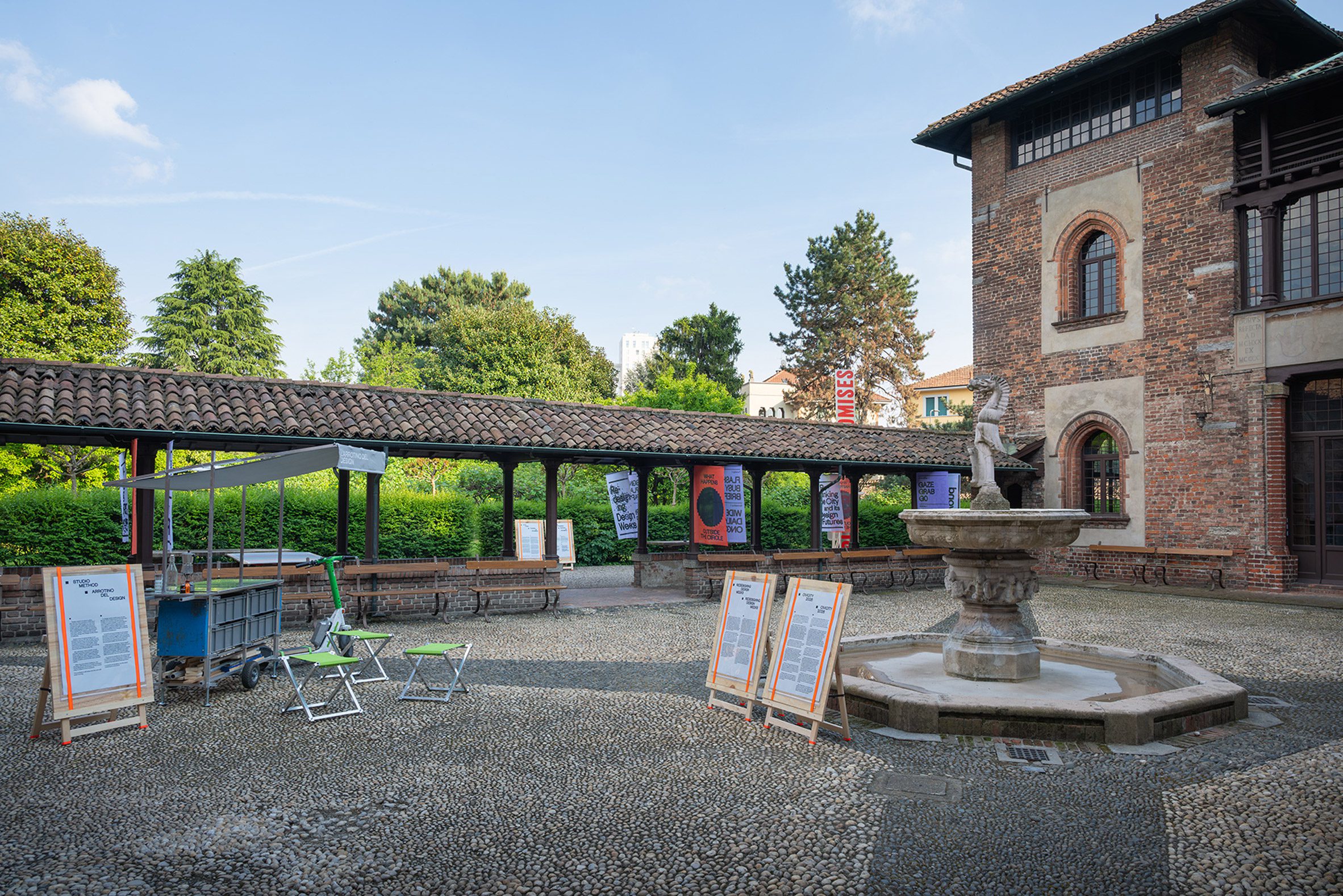 Wide shot photo showing the Civicity exhibition in a courtyard in Milan