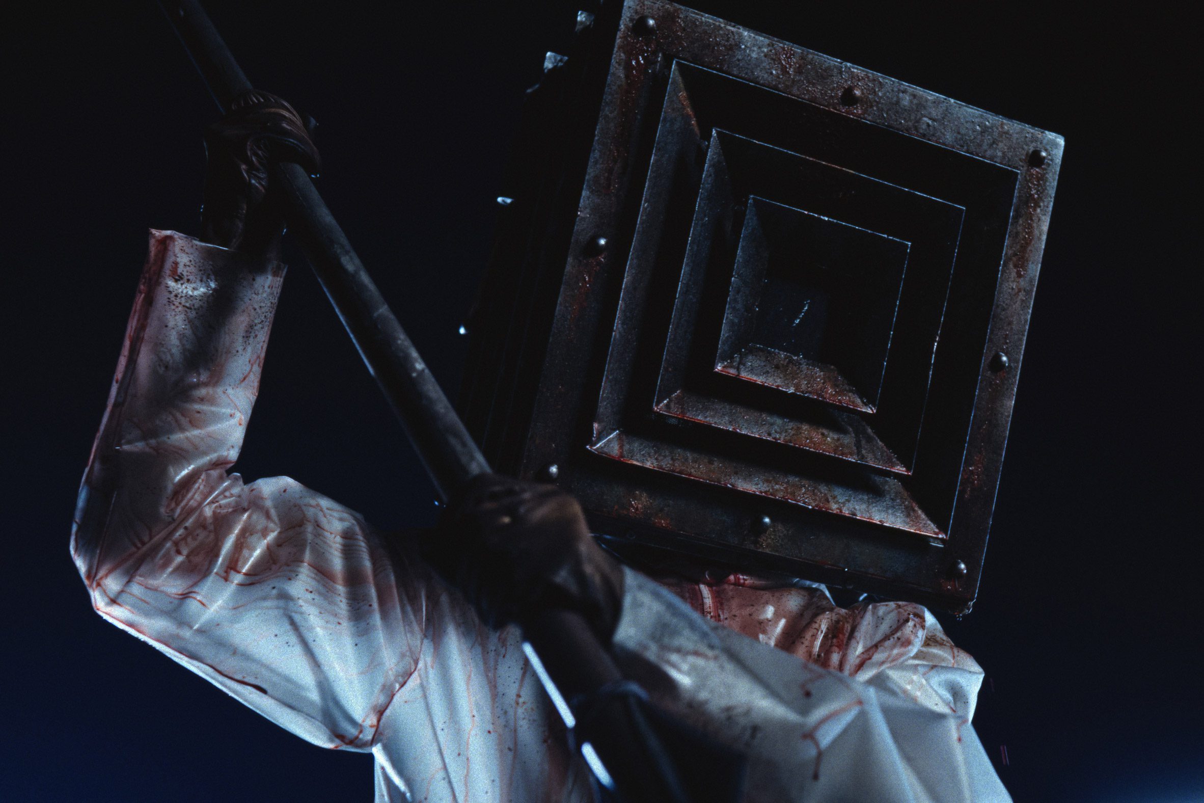Horror film character holding a spear