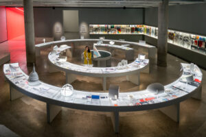 Curved display desks hold drawings, books and models from Devlin's career